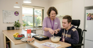 Support worker assisting participant with daily living tasks like cooking